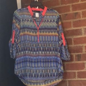 Signature Studio “M” 100% polyester. Will need camisole under it. 3/4 sleeve.